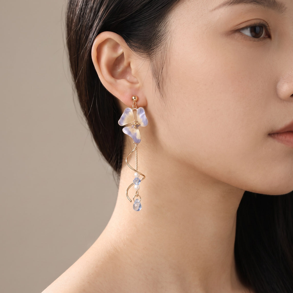 Pansy Earrings worn on the ear