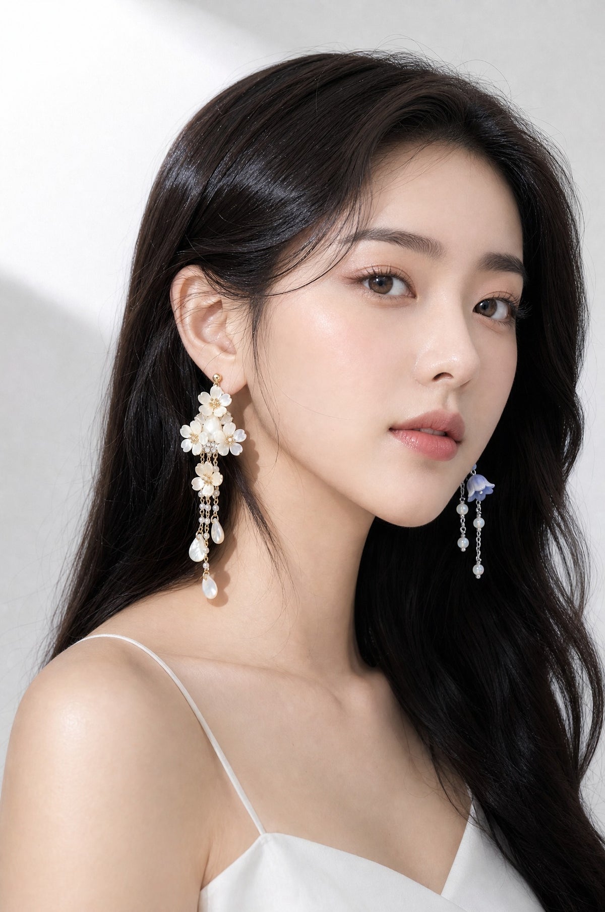 The Ear Party — two different earrings worn, one in each ear