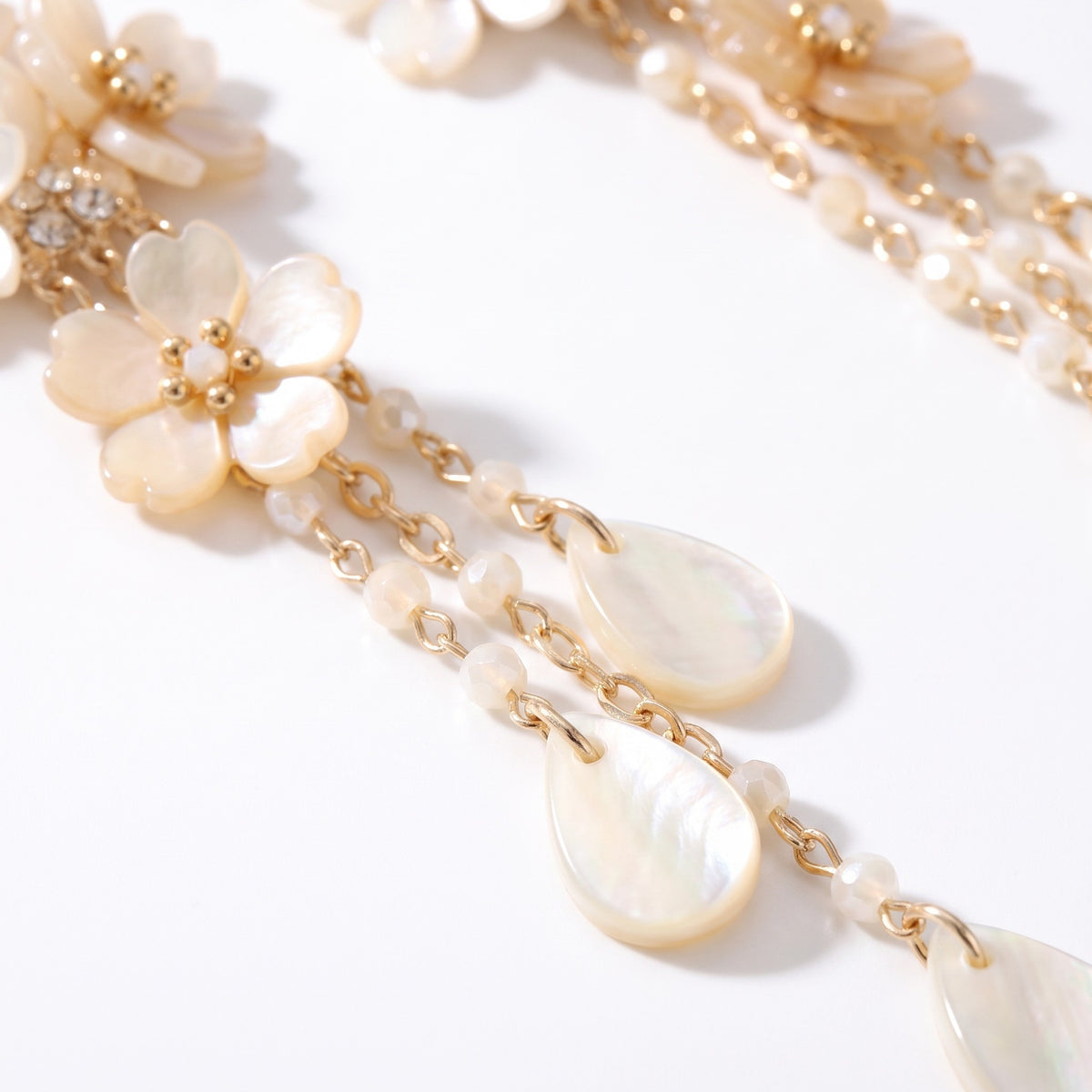 Close detail of the ivory blossoms and pearlescent teardrops