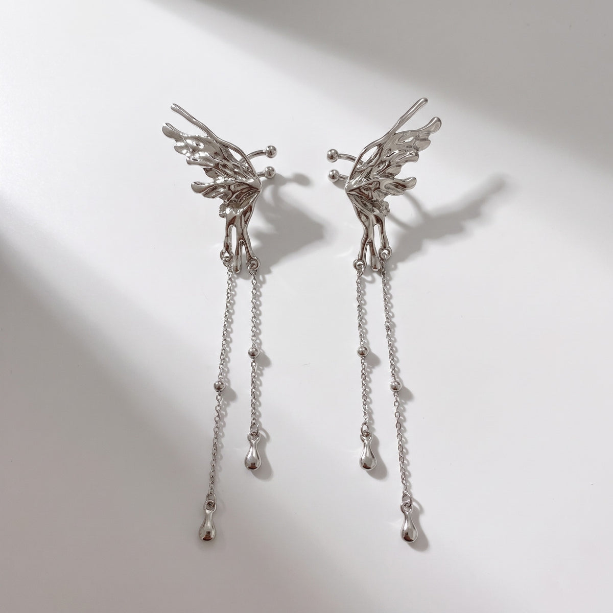 Seraph Earrings photographed as a pair on a white ground