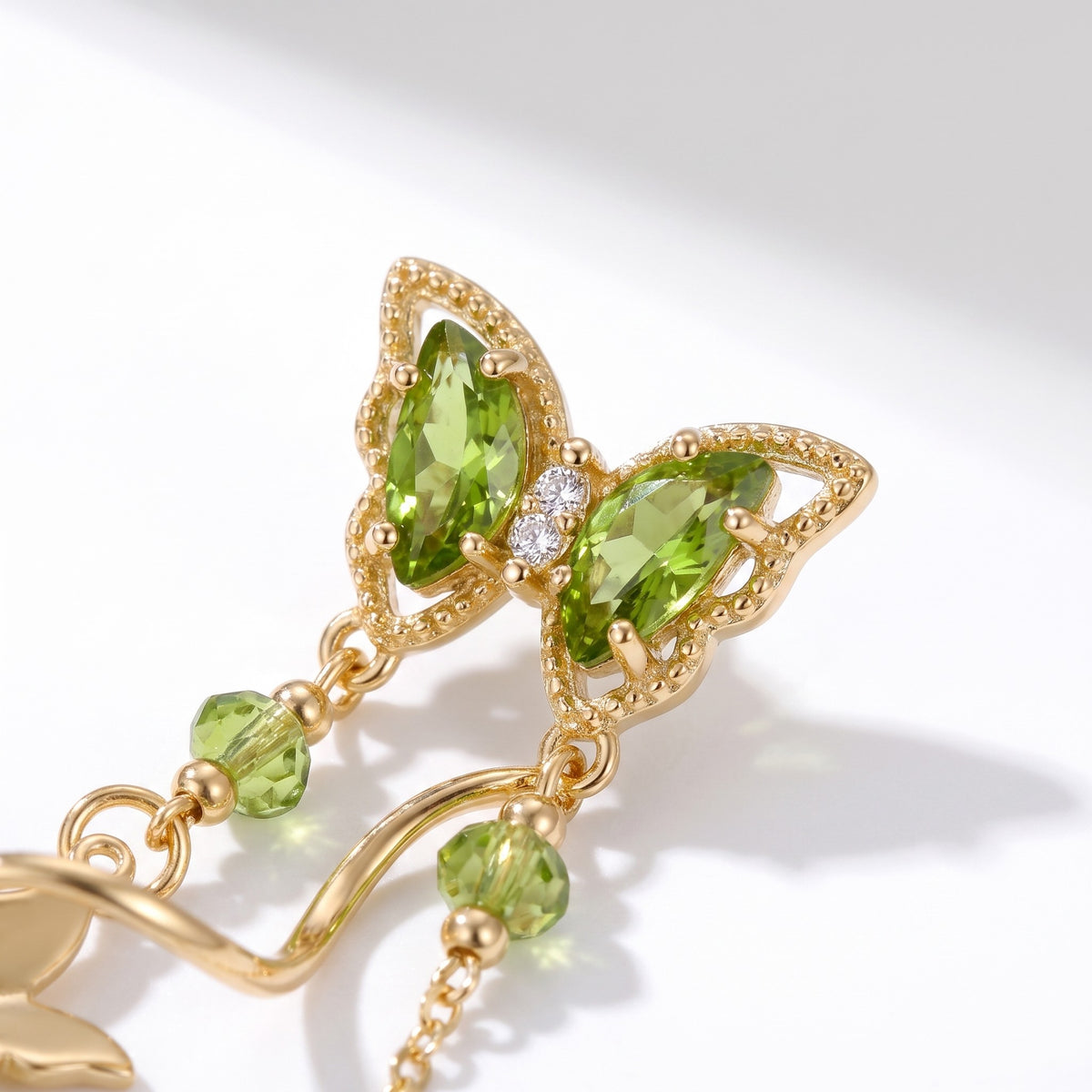 Close detail of the green butterfly and twisting stem